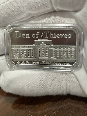 Den of Thieves 1 OZ .999 Silver Shield Bar Not Federal amp; NO Reserves CAP